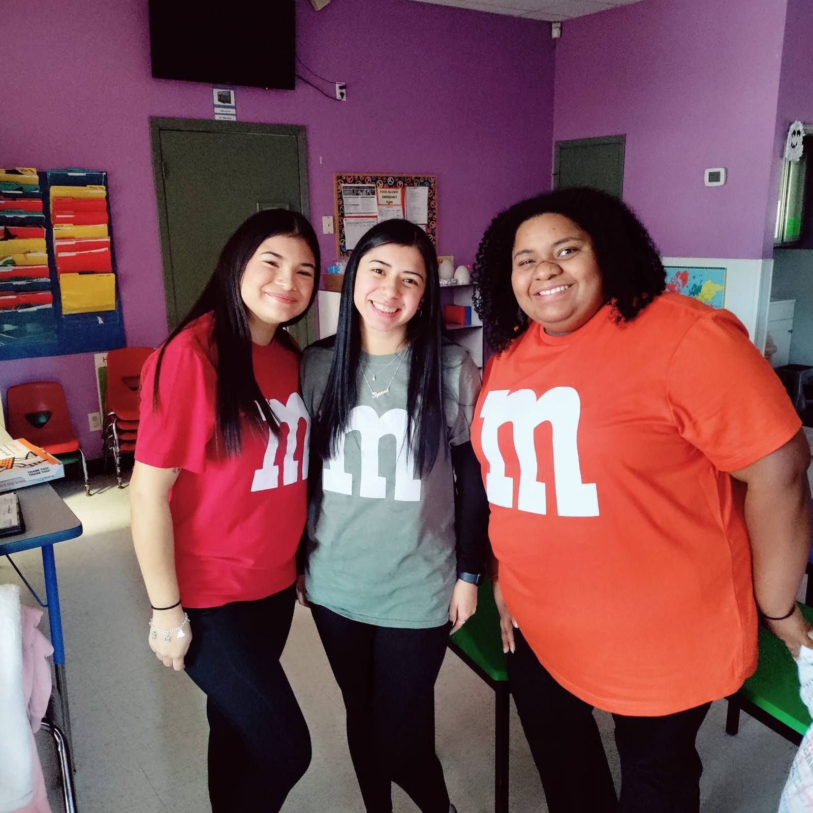 Three teachers dressed as candy for a class dress up day