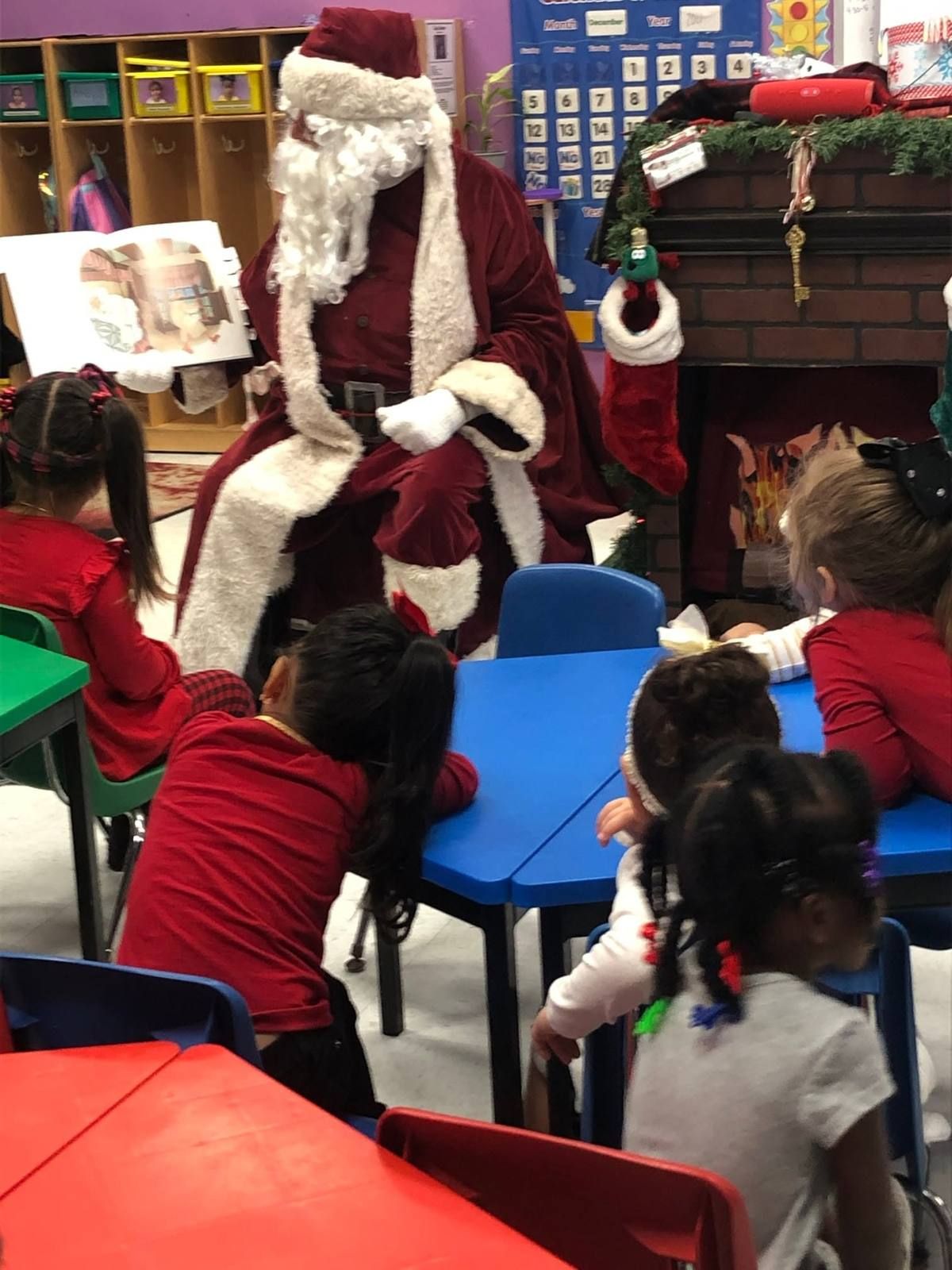 Santa reading a story to the class