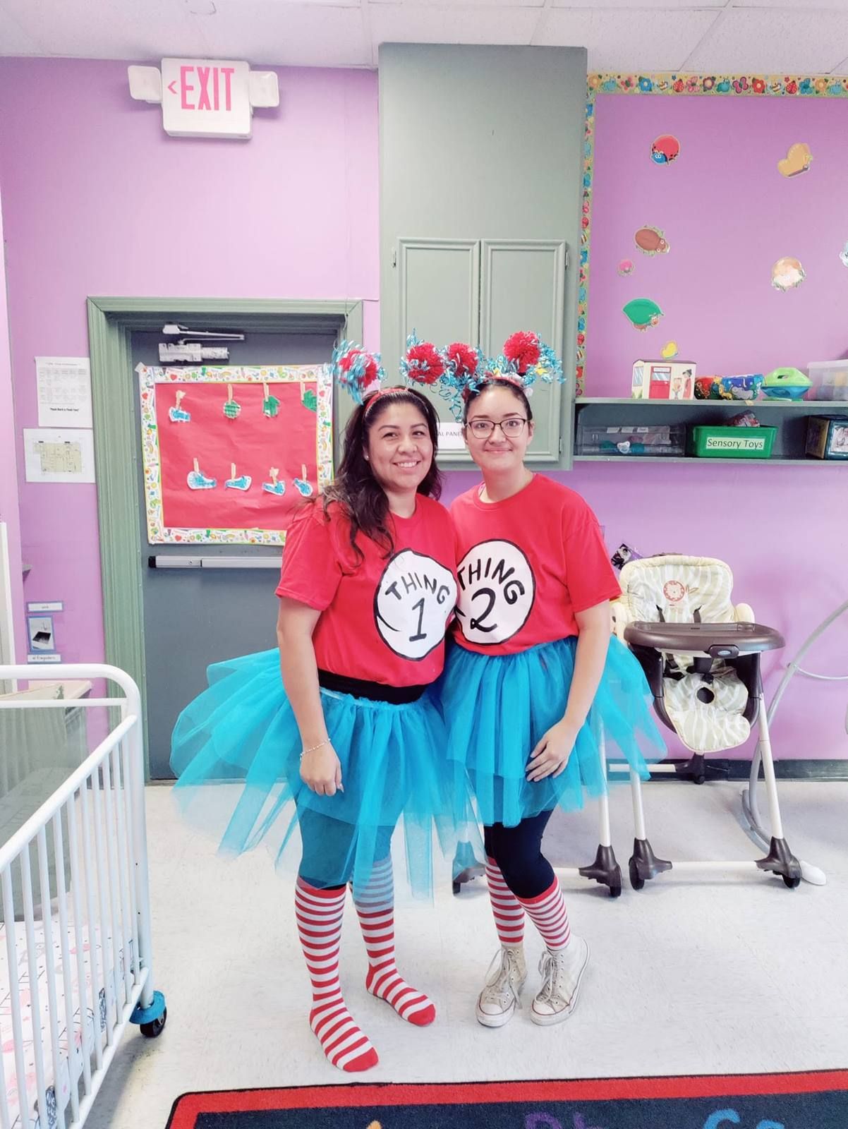 Two teachers dressed as Thing 1 and Thing 2