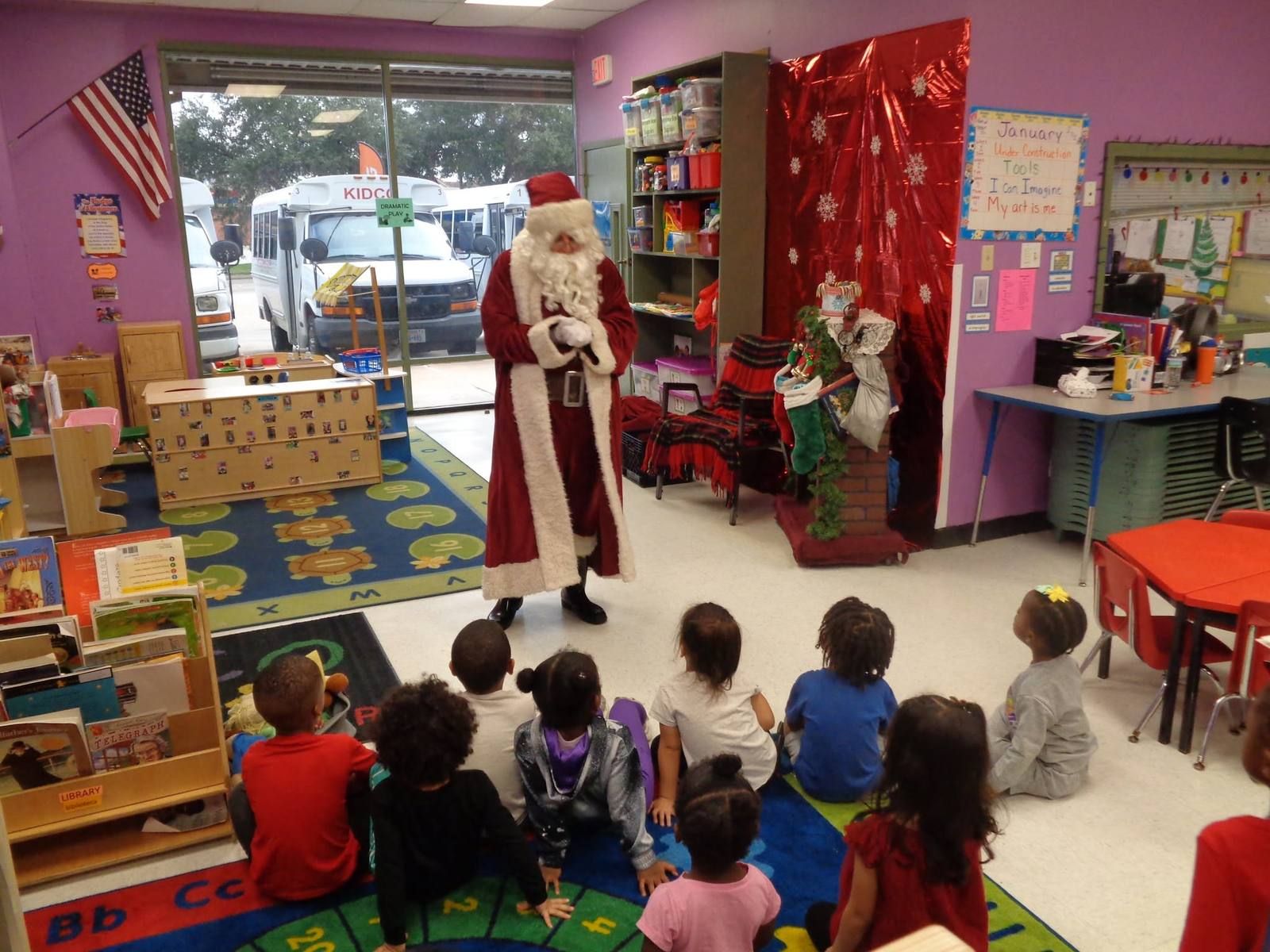 Santa visiting a Pre-K class sitting on the rug